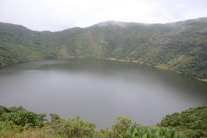 A view of the crater lake atop Bisoke Mountain, part of what to experiences on your Bisoke mountaing hiking experience