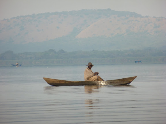 A fisherman with a local boat on Lake Nyarakigugu